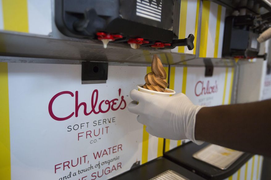 In this June 20, 2017 photo, a cup of dark chocolate vegan soft serve is prepared at Chloe's Soft Serve Fruit Co., in New York. A new generation of dairy-free vegan ice cream varieties features creamier bases and more interesting flavors that appeal to vegans, vegetarians and meat eaters alike. (AP Photo/Michael Noble Jr.)