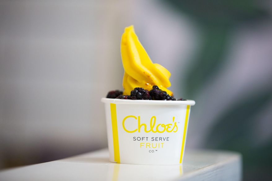 This June 20, 2017 photo shows a cup of vegan mango soft serve with blackberries at Chloe's Soft Serve Fruit Co., in New York. A new generation of dairy-free vegan ice cream varieties features creamier bases and more interesting flavors that appeal to vegans, vegetarians and meat eaters alike. (AP Photo/Michael Noble Jr.)