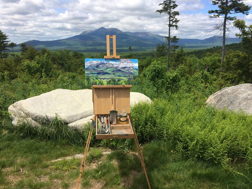 In this June 14, 2017 photo, a painting of Mount Katahdin by Marsha Donahue of Millinocket, Maine. Donahue owns a local art gallery and made the painting from a scenic overlook within Katahdin Woods and Waters National Monument. (AP Photo/Patrick Whittle)