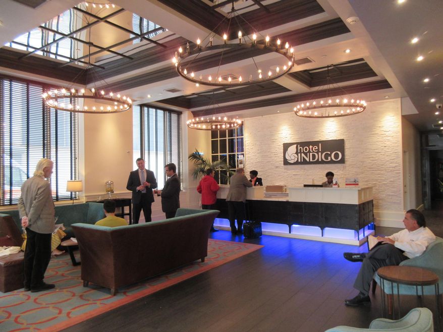 This May 11, 2017 photo show the lobby of Hotel Indigo, a boutique hotel in downtown Newark, N.J. Riots scarred Newark 50 years ago this summer, but tourism officials are hoping to attract more visitors as the city charts its comeback. (AP Photo/Beth J. Harpaz)