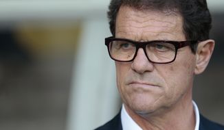 FILE - In this June 14, 2015 file photo, Russia&#x27;s coach Fabio Capello watches his players during the Euro 2016 qualifying soccer match between Russia and Austria, in Moscow, Russia. Capello, winner of the UEFA Champions League in 1994 and who also led the national teams of England and Russia to the 2010 and 2014 World Cups, was appointed as head coach of Jiangsu Suning in June. (AP Photo/Ivan Sekretarev, File)