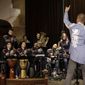 n this picture taken on Thursday, Feb. 23, 2017, members of the Tap Tap orchestra perform during a charity concert in Prague Czech Republic. What was created some 18 years ago in efforts to give kids some extracurricular activity at a renowned school for the disabled in Prague has become a major music act that has drawn millions of listeners and fans, first at home and gradually abroad. (AP Photo/Petr David Josek)