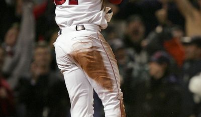 FILE - In this Oct. 17, 2004, file photo, Boston Red Sox&#39;s Dave Roberts celebrates after scoring the tying run against New York Yankees in the ninth inning of Game 4 of the ALCS in Boston. Roberts leans on his mother-in-law to handle the influx of fan mail he still receives daily from appreciative folks in Boston. (AP Photo/Charles Krupa, File)