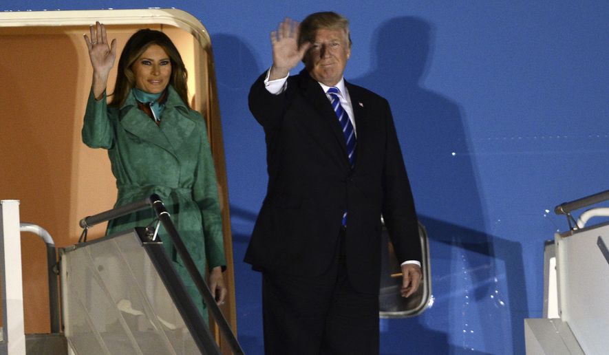 President Trump and the first lady Melania Trump wave from the Air Force One upon their arrival Warsaw, Poland, Wednesday, July 5, 2017. Trump arrived in Poland ahead of an outdoor address in Warsaw on Thursday and energy talks with European leaders. (AP Photo/Alik Keplicz)