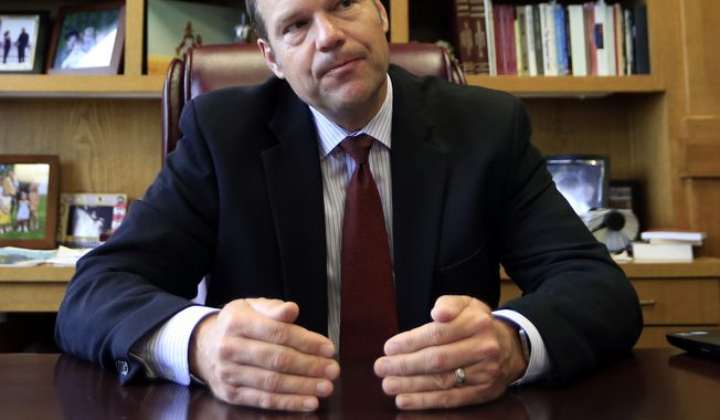 Kansas Secretary of State Kris Kobach talks with a reporter in his office in Topeka on May 17, 2017. Kobach, the vice chair of President Donald Trump&#x27;s election fraud commission, is taking issue with reports that a majority of states are refusing to comply with a request for voter information. Kobach says that news stories stating that 44 states have &quot;refused&quot; to provide voter information to the commission are &quot;patently false.&quot; (Associated Press) **FILE**
