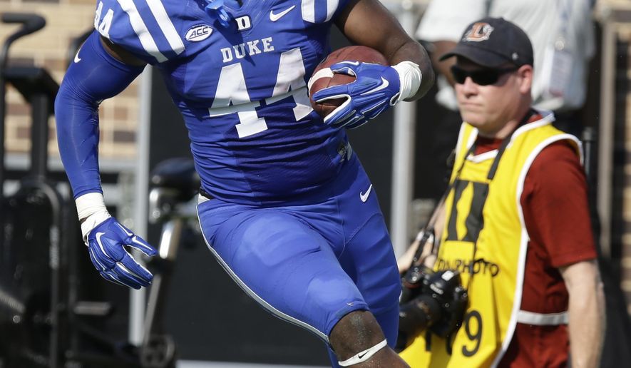 FILE - In this Sept. 10, 2016, file photo, Duke's Joe Giles-Harris (44) runs with the ball following an interception against Wake Forest during the first half of an NCAA college football game in Durham, N.C. Giles-Harris is proud that he started 12 games as a redshirt freshman at Duke. During his sophomore year, he wants to improve on that number _ and the only way to do that is to lead the Blue Devils back to a bowl game. (AP Photo/Gerry Broome)