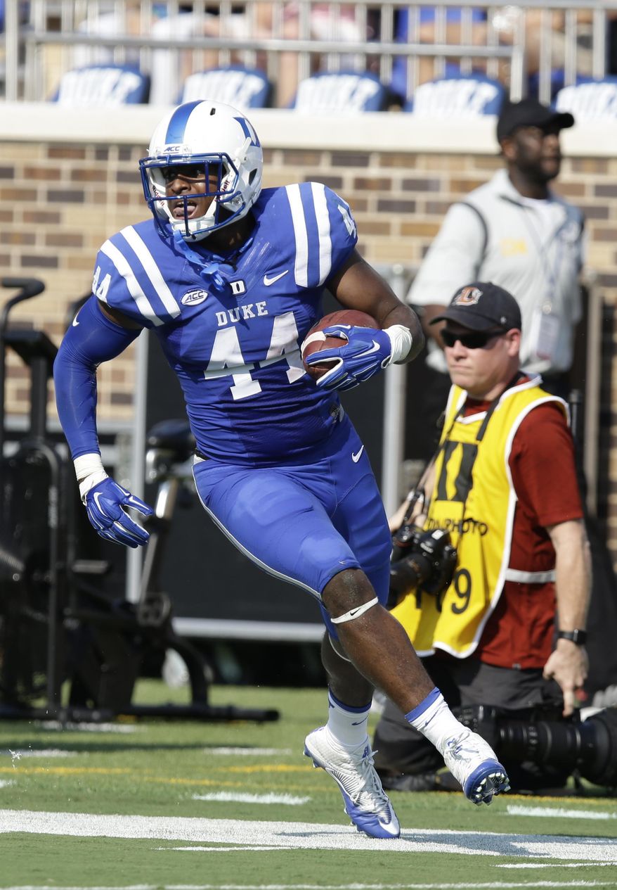 FILE - In this Sept. 10, 2016, file photo, Duke's Joe Giles-Harris (44) runs with the ball following an interception against Wake Forest during the first half of an NCAA college football game in Durham, N.C. Giles-Harris is proud that he started 12 games as a redshirt freshman at Duke. During his sophomore year, he wants to improve on that number _ and the only way to do that is to lead the Blue Devils back to a bowl game. (AP Photo/Gerry Broome)