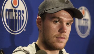 FILE - In this May 12,  2017, file photo, Edmonton Oilers&#39; Connor McDavid speaks to the media during an NHL hockey news conference in Edmonton, Alberta. The Oilers have signed star captain Connor McDavid to an eight-year, $100 million deal, Wednesday, July 5, 2017. (Jason Franson/The Canadian Press via AP, File)