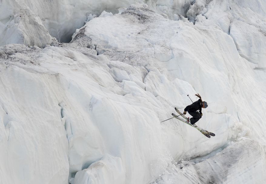A skiier heads down the advanced skiier-only slope at the Bearstooth Basin Summer Ski Area in the Bearstooth Mountain Range in northern Wyoming on Thursday, June 21, 2017. (Mark Davis/The Powell Tribune via AP)
