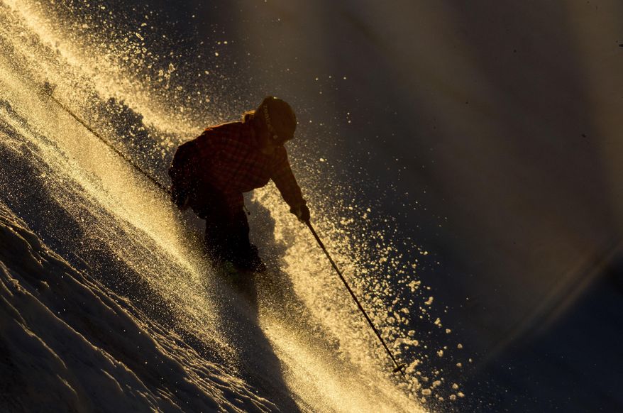 A skiier heads down the advanced skiier only slope at the Bearstooth Basin Summer Ski Area in the Bearstooth Mountain Range in northern Wyoming on Thursday, June 21, 2017. (Mark Davis/The Powell Tribune via AP)