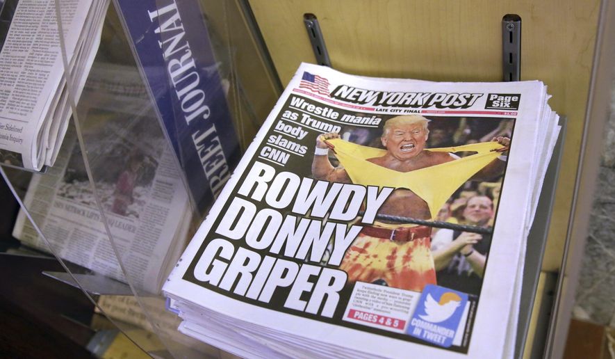Copies of the New York Post with an illustration of President Donald Trump as a professional wrestler on the front page are displayed at a newsstand in New York City, Monday, July 3, 2017. On Sunday, Trump&#39;s apparent fondness for wrestling emerged in a tweeted mock video that shows him pummeling a man in a business suit with his face obscured by the CNN logo. (AP Photo/Richard Drew)