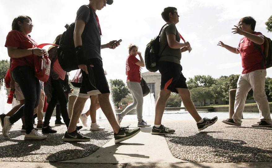 In this June 13, 2017 photo, University of Houston incoming students tour the campus as part of an orientation in Houston. (Elizabeth Conley/Houston Chronicle via AP)
