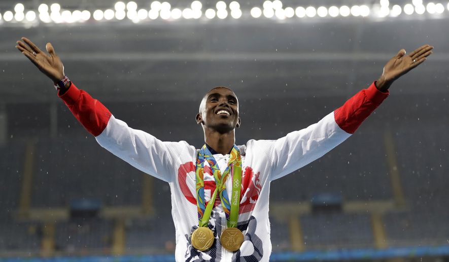 FILE - In this Aug. 20, 2016, file photo, Britain's Mo Farah celebrates winning the gold medal at the men's 5000-meter medals ceremony, during the athletics competitions of the 2016 Summer Olympics at the Olympic stadium in Rio de Janeiro, Brazil. Data posted by Russian-linked hackers show four-time Olympic gold medalist runner Mo Farah's blood readings were once flagged by track's governing body.(AP Photo/Jae C. Hong, File)