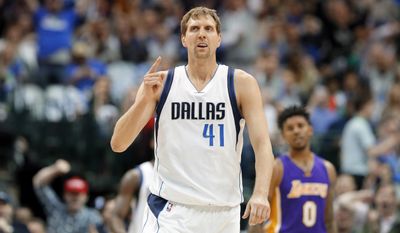 FILE- In this March 7, 2017, file photo, Dallas Mavericks forward Dirk Nowitzki, of Germany, celebrates sinking a three-point basket early in the first quarter of an NBA basketball game against the Los Angeles Lakers in Dallas. A person with knowledge of the agreement says the Dallas Mavericks and Dirk Nowitzki have agreed on a two-year, $10 million deal that assures a 20th season for the star forward.  The second year of the contract carries a team option, the person told The Associated Press, Thursday, July 6, 2017, on condition of anonymity because the team hasn&#39;t announced the deal. The 39-year-old Nowitzki is set to join Kobe Bryant of the Lakers as the only players to spend 20 seasons with one franchise. (AP Photo/Tony Gutierrez, File)