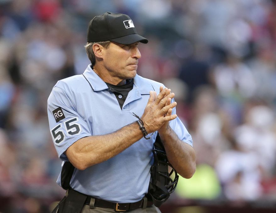 FILE - In this April 8, 2017 file photo, MLB umpire Angel Hernandez (55) is seen in the first inning during a baseball game between the Arizona Diamondbacks and the Cleveland Indians, in Phoenix. Hernandez, a big league umpire for nearly a quarter-century, sued Major League Baseball on Monday, July 3, 2017, alleging race discrimination. In a complaint filed in U.S. District Court in Cincinnati, Hernandez, 55, who was born in Cuba, alleges MLB chief baseball officer Joe Torre &amp;quot;has a history of animosity towards Hernandez stemming from Torre&#39;s time as manager of the New York Yankees.&amp;quot; (AP Photo/Rick Scuteri, File)