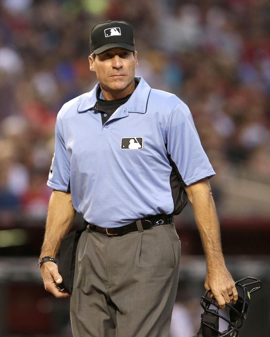 FILE - In this April 8, 2017 file photo, MLB umpire Angel Hernandez (55) is seen in the first inning during a baseball game between the Arizona Diamondbacks and the Cleveland Indians in Phoenix. Hernandez, a big league umpire for nearly a quarter-century, sued Major League Baseball on Monday, July 3, 2017, alleging race discrimination. In a complaint filed in U.S. District Court in Cincinnati, Hernandez, 55, who was born in Cuba, alleges MLB chief baseball officer Joe Torre &amp;quot;has a history of animosity towards Hernandez stemming from Torre&#39;s time as manager of the New York Yankees.&amp;quot; (AP Photo/Rick Scuteri, File)