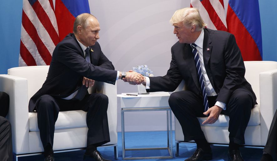 President Donald Trump shakes hands with Russian President Vladimir Putin at the G-20 Summit, Friday, July 7, 2017, in Hamburg. (AP Photo/Evan Vucci)