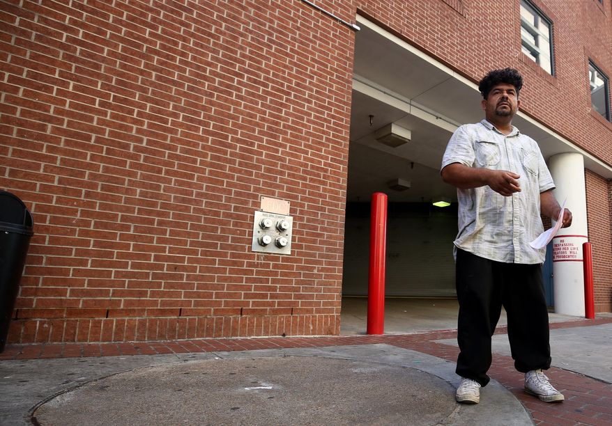 In this June 7, 2017, photo, Edward Gonzales, 38, who was released from jail on a personal recognizance bond from Harris County jail stands on Commerce Street in Houston. Officials in Texas’ most populous county are expressing concern a federal court order that found the Houston-area’s bail system discriminates against poor people accused of misdemeanor crimes is forcing authorities to release possibly dangerous individuals who are failing to show up for future court hearings. (Godofredo A. Vasquez /Houston Chronicle via AP)