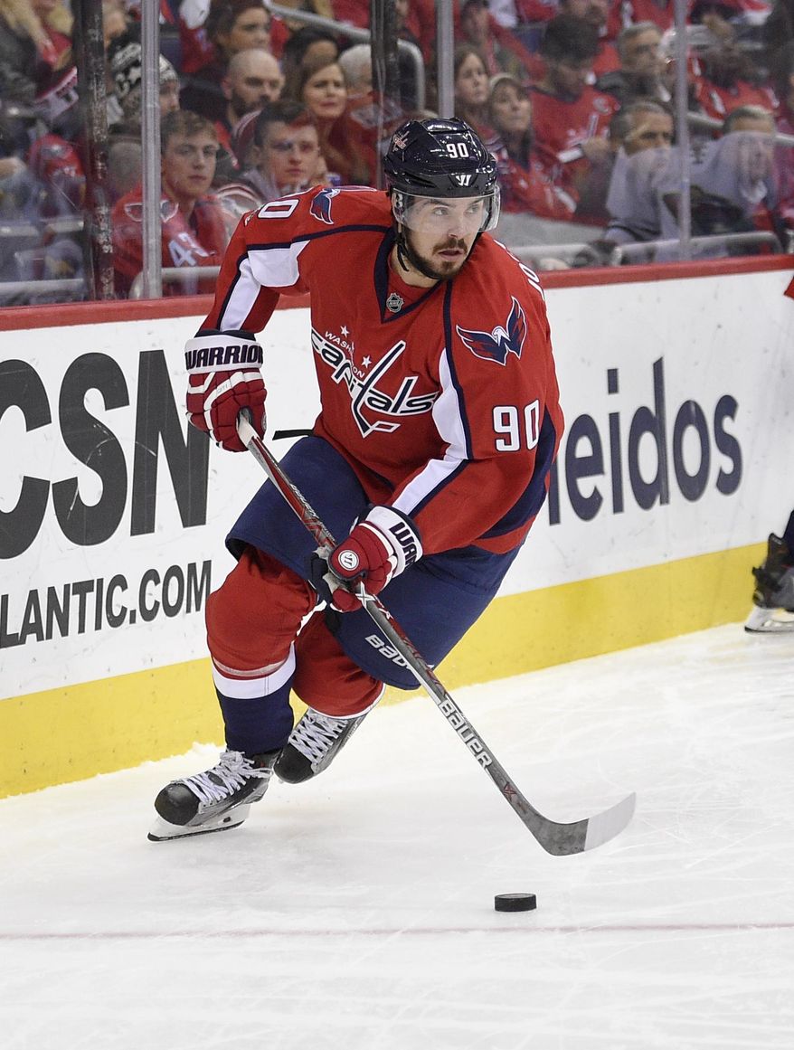 FILE - In this March 14, 2017, file photo, Washington Capitals left wing Marcus Johansson (90), of Sweden, skates during the second period of an NHL hockey game against the Minnesota Wild in Washington. After being surprised on Sunday by a deal that sent him to the Devils for two draft picks in 2018, Johansson on Friday, July 7, 2017,  said he is looking forward to the chance to play for a rebuilding franchise that finished at the bottom of the Eastern Conference this past season. (AP Photo/Nick Wass, File)