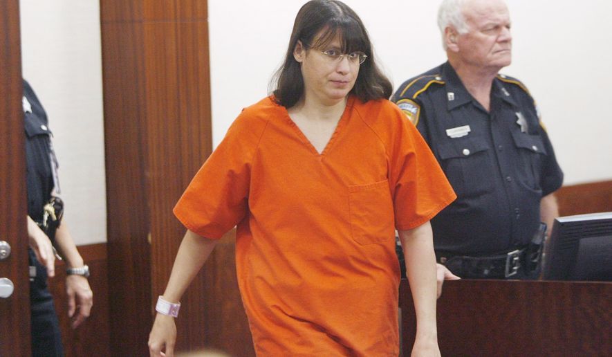 FILE-in this Thursday, July 27, 2006 file photo, Andrea Yates walks into the courtroom for a hearing, in Houston, where she was committed to the maximum-security North Texas State Hospital in Vernon, Texas. Psychologists and others who study cases of mothers accused of killing their children say such crimes aren't as uncommon as people might believe.(AP Photo/Brett Coomer, Pool, File)