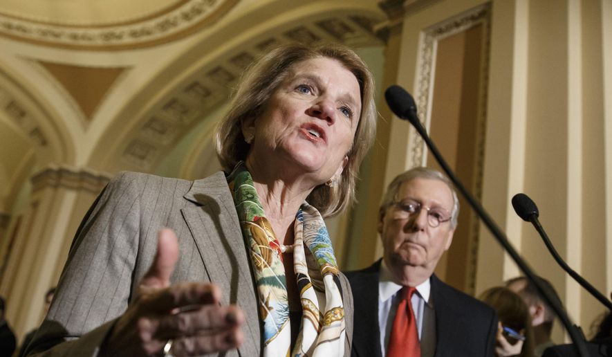 In this Jan. 20, 2015, file photo, Sen. Shelley Moore Capito, R-W.Va., accompanied by Senate Majority Leader Mitch McConnell of Ky., speaks during a news conference on Capitol Hill in Washington. (AP Photo/J. Scott Applewhite, File)