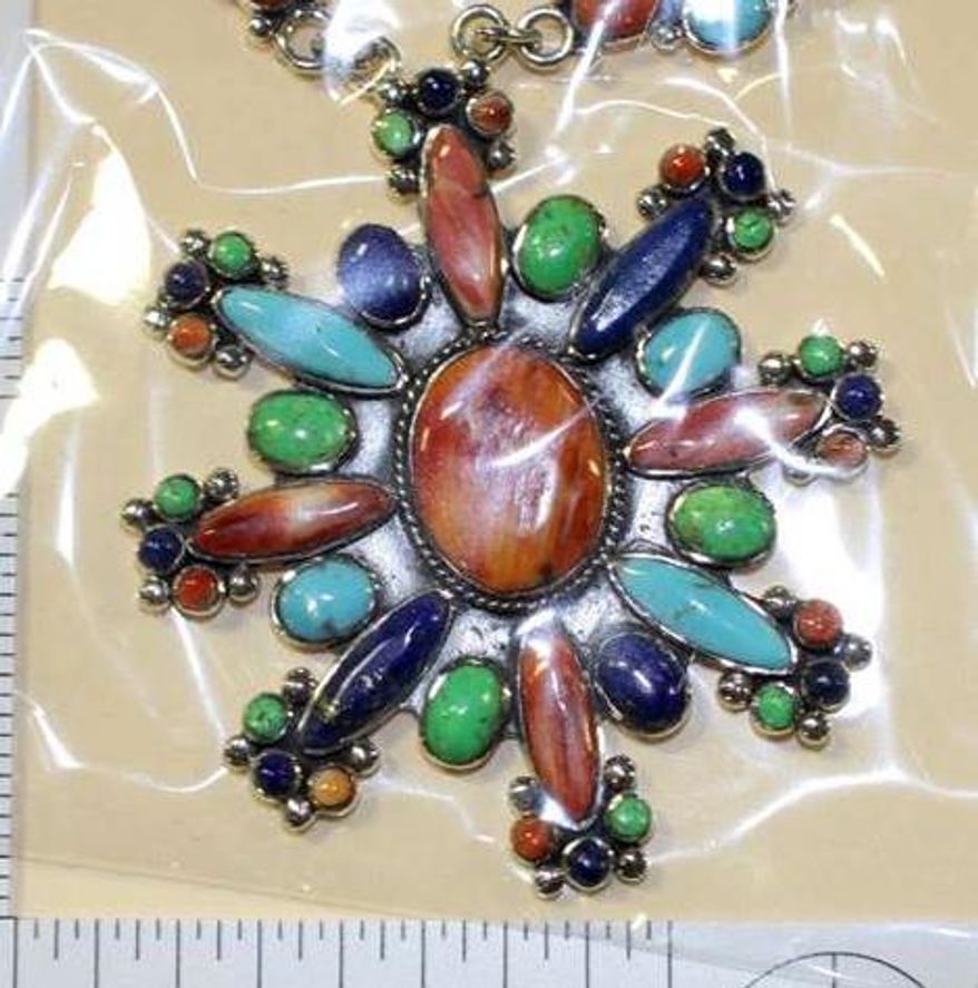 In this undated photo provided by U.S. Fish and Wildlife Service shows fake Native American styled-jewelry seized by federal officials during a 2015 investigation in New Mexico. Federal prosecutors are preparing for trial in an ambitious investigation that traced falsified Native American art from the Philippines to galleries across the United States. Efforts to prevent the sale of counterfeit tribal art and jewelry will be the focus of testimony Friday, July 7, 2017, as two U.S. senators hold a field hearing in New Mexico about protecting legitimate American Indian artists and markets from fraudulent goods. (U.S. Fish and Wildlife Service via AP)