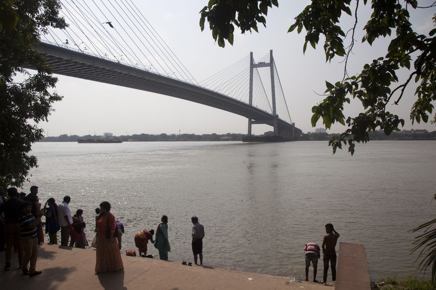 In this April 15, 2017 photo, River Ganga or the Ganges is seen from a tourist spot in Kolkata, West Bengal, India. Elizabeth Brenner is on a pilgrimage following the last footsteps of her son who was studying abroad in India in 2011. She believes that part of her son&#39;s remains flowed across India through the Ganga river into the Bay of Bengal. Hundreds of thousands of American students study abroad each year, but no one can say exactly how many are injured or die. (AP Photo/Rishabh R. Jain)