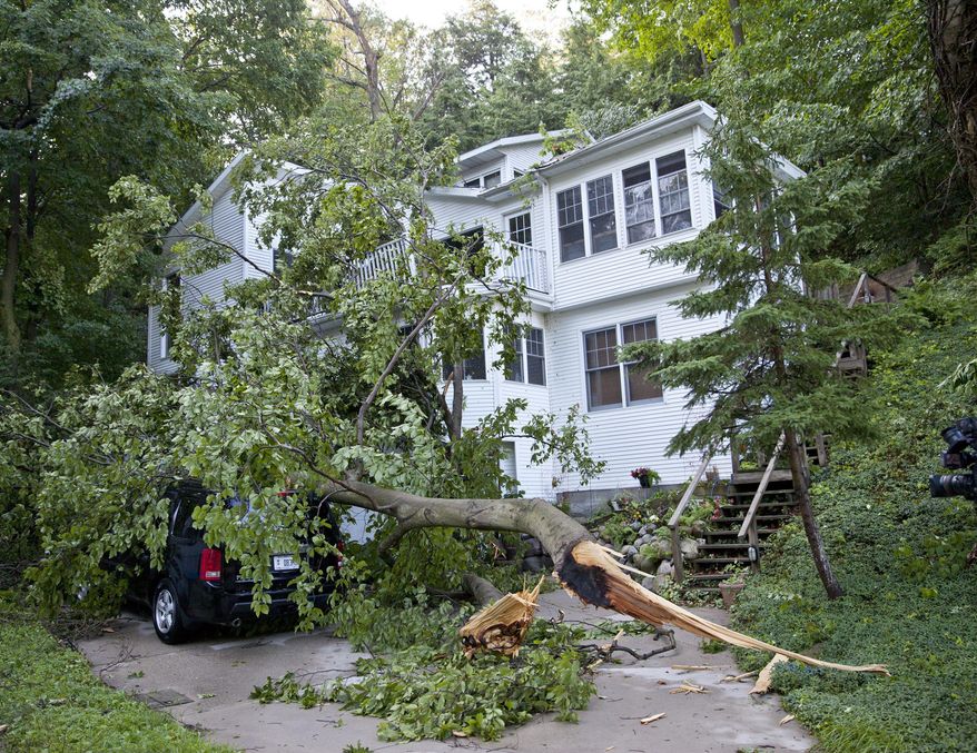 Storm damage on Lovers Lane in Grand Haven on Friday, July 7, 2017. Nearby, a 72-year-old man was reportedly killed overnight when a large tree fell on his home during a severe thunderstorm on Poplar Ridge. (Cory Morse /The Grand Rapids Press via AP)