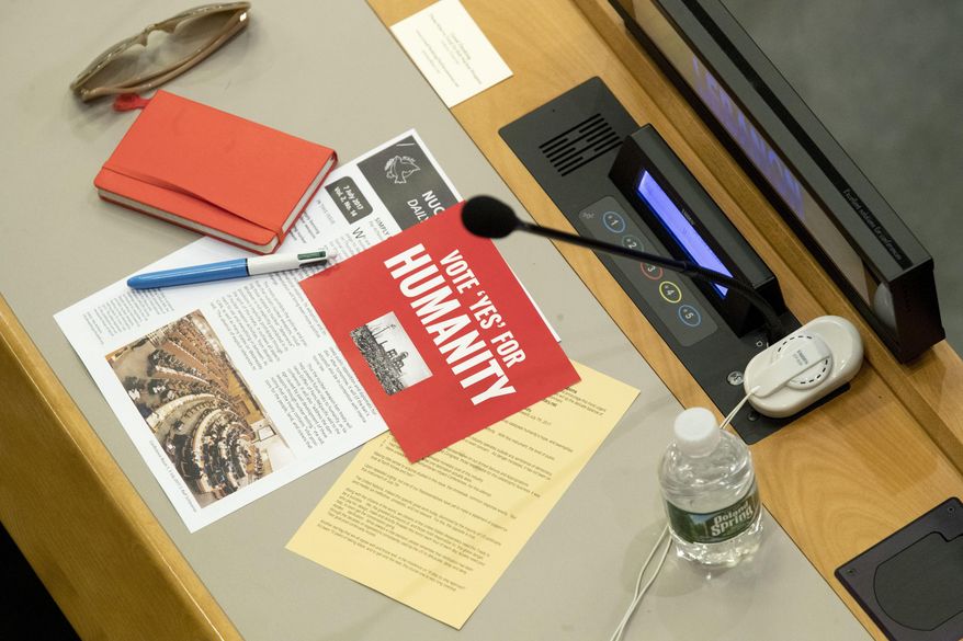 Leaflets are seen on a delegates desk before a vote by the conference to adopt a legally binding instrument to prohibit nuclear weapons, leading towards their total elimination, Friday, July 7, 2017 at United Nations headquarters. More than 120 countries have approved the first-ever treaty banning nuclear weapons at a U.N. meeting boycotted by all nuclear-armed nations. Friday's vote was 122 countries in favor with the Netherlands opposed and Singapore abstaining.(AP Photo/Mary Altaffer)