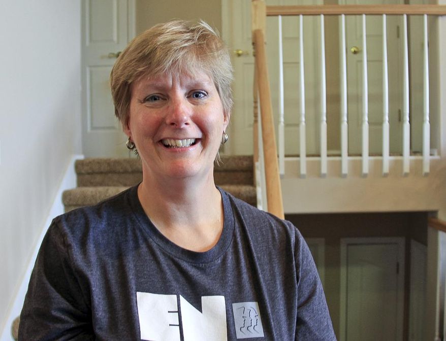 In this June 23, 2017 photo, Stephanie Caudle, a missionary with Cadence International, poses for a photo at home in Eagle River, Alaska. Caudle and her husband run The Homestead, an Eagle River hospitality house for military members from Joint Base Elmendorf-Richardson. (Kirsten Swann/Chugiak-Eagle River Star via AP)