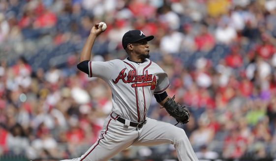 Atlanta Braves starting pitcher Julio Teheran pitches during the first inning of a baseball game against the Washington Nationals, Saturday, July 8, 2017, in Washington. (AP Photo/Mark Tenally)