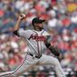 Atlanta Braves starting pitcher Julio Teheran pitches during the first inning of a baseball game against the Washington Nationals, Saturday, July 8, 2017, in Washington. (AP Photo/Mark Tenally)