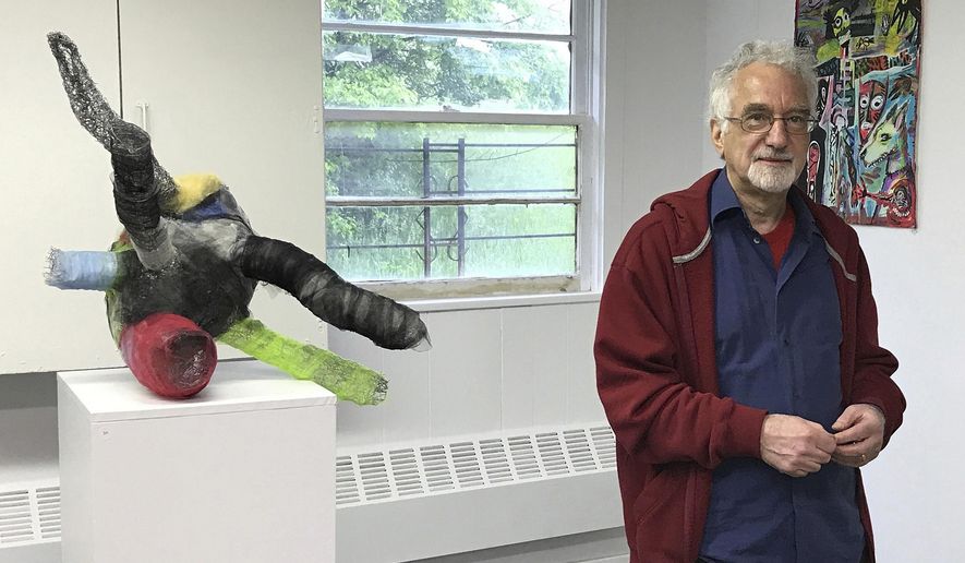 This May 13, 2017 photo shows Larry Dell at the opening of an art exhibition he curated in Livingston, N.J. Dell, 68, grew up in New York City with parents he loved. He learned only nine years ago that he had been adopted as an infant, and that he was one of five siblings in his birth family. "It was a shock to learn that, and the bigger shock was when I couldn't find out who my birth parents were," he said. (Jane Dell via AP)
