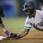 Colorado Rockies first baseman Mark Reynolds, left, tags out Chicago White Sox&#39;s Tim Anderson (7) at first base on a pick-off throw from pitcher Jeff Hoffman during the fourth inning of a baseball game Saturday, July 8, 2017, in Denver.(AP Photo/Joe Mahoney)