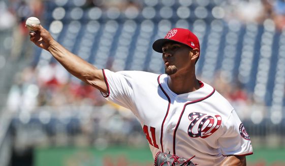 Washington Nationals starting pitcher Joe Ross throws during the first inning of a baseball game against the Atlanta Braves at Nationals Park, Sunday, July 9, 2017, in Washington. (AP Photo/Alex Brandon)