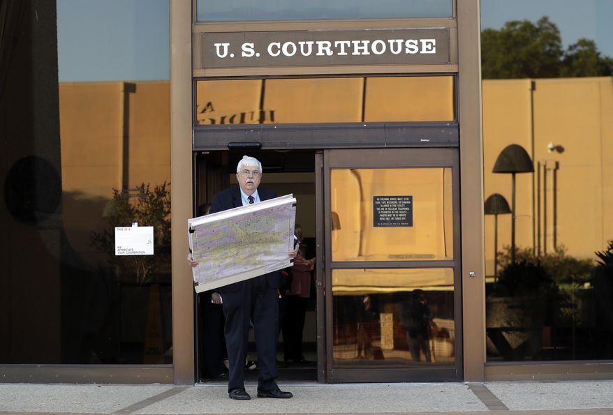 ADDS NAME OF MAN AS RUSS TIDWELL - Russ Tidwell, a former lobbyist who is helping minority rights groups sue Texas over Republican-drawn voting maps enters the federal court house, Monday, July 10, 2017, in San Antonio, where a redistricting trial is set to begin. Federal courts earlier this year found that Texas passed election laws to purposefully discriminate against Hispanic and black voters and the trial starting today could redraw Texas voting maps before 2018 and bolster Democratic efforts to reclaim Congress. (AP Photo/Eric Gay)