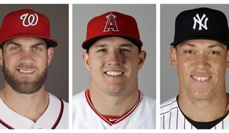 FILE - From left are 2017 file photos showing Bryce Harper, of the Washington Nationals, Mike Trout of the Los Angeles Angels and Aaron Judge of the New York Yankees. Harper, Trout and Judge have become the face of baseball as a gleaming, modernist ballpark and a city known for its Latino culture host the All-Star Game for the first time. (AP Photo/File)