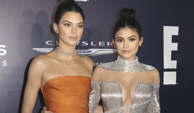 FILE - In this Jan. 8, 2017, file photo, Kendall Jenner, left, and Kylie Jenner arrive at the NBCUniversal Golden Globes afterparty in Beverly Hills, Calif. The Jenner sisters&#39; fashion label, Kendall + Kylie, said Sunday, July 9, that it sold only two &amp;quot;vintage&amp;quot; T-shirts with the late rapper Tupac Shakur&#39;s likeness on them before pulling the shirts from the marketplace. The statement came in response to a photographer&#39;s lawsuit accusing the Jenners of copyright infringement for using two of his photos for the shirts, which briefly sold for $125 apiece. (Photo by Rich Fury/Invision/AP, File)