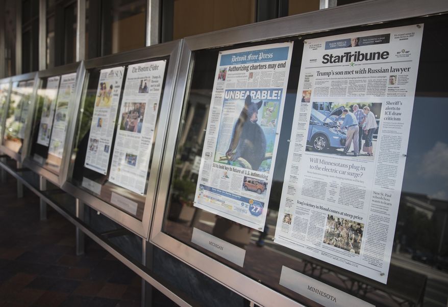 Newspaper front pages are displayed at the Newseum in Washington, Monday, July 10, 2017. News outlets are seeking permission from Congress for the right to negotiate jointly with Google and Facebook, two companies that dominate online advertising and online news traffic. (AP Photo/Carolyn Kaster)