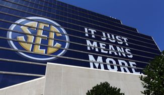 The SEC logo is shown outside of the Hyatt Regency hotel for the NCAA college football Southeastern Conference&#39;s annual media gathering, Monday, July 10, 2017, in Hoover, Ala. (AP Photo/Butch Dill)