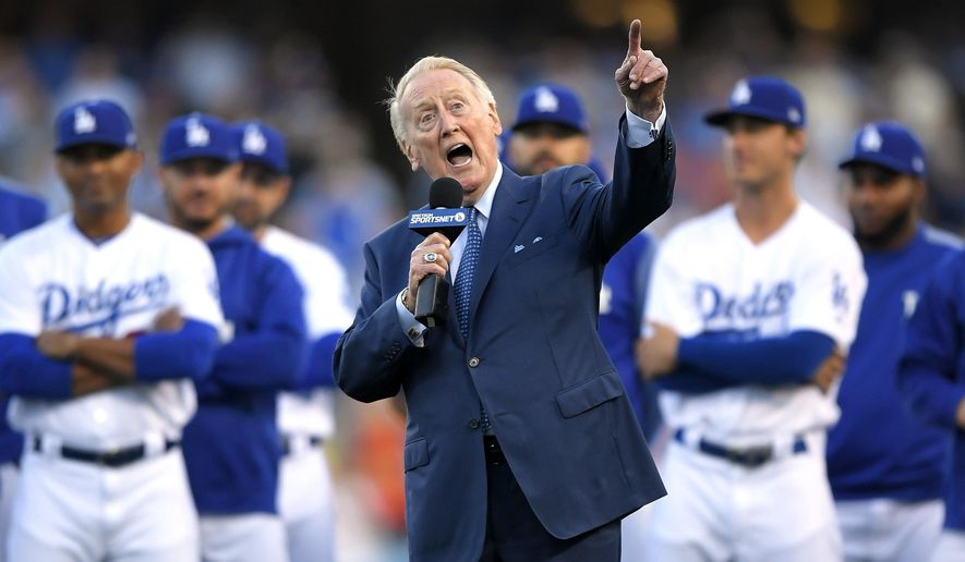 FILE - In this May 3, 2017, file photo, Los Angeles Dodgers broadcaster Vin Scully speaks during his induction into the team's Ring of Honor prior to a baseball game between the Dodgers and the San Francisco Giants, in Los Angeles. Vin Scully will receive the Icon Award at The ESPYS, with actor Bryan Cranston presenting the honor given to those whose careers have left a lasting impression on the sports world.Scully retired last fall after 67 years calling Los Angeles Dodgers games. (AP Photo/Mark J. Terrill, File)