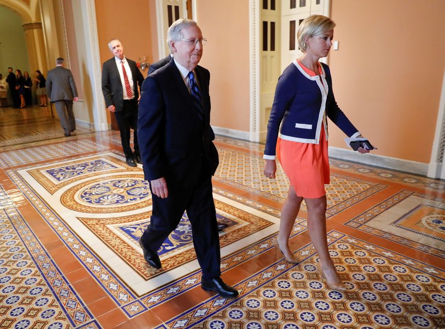 Senate Majority Leader Mitch McConnell said he will unveil a revised health care bill and get a budget analysis to assuage the fears of holdout Republicans. (Associated Press)