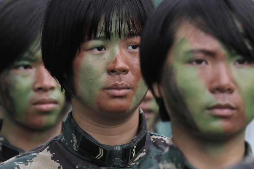 Female soldiers of Chinese People&#39;s Liberation Army (PLA) line up before demonstrating skills during an open day of Stonecutter Island naval base in Hong Kong, Saturday, July 8, 2017, to mark the 20th anniversary of Hong Kong handover to China. China&#39;s sole operating aircraft carrier arrived on its first port call to Hong Kong on Friday as part of efforts to stir patriotism amid commemorations of the city&#39;s handover from British to Chinese rule 20 years ago. (AP Photo/Kin Cheung)