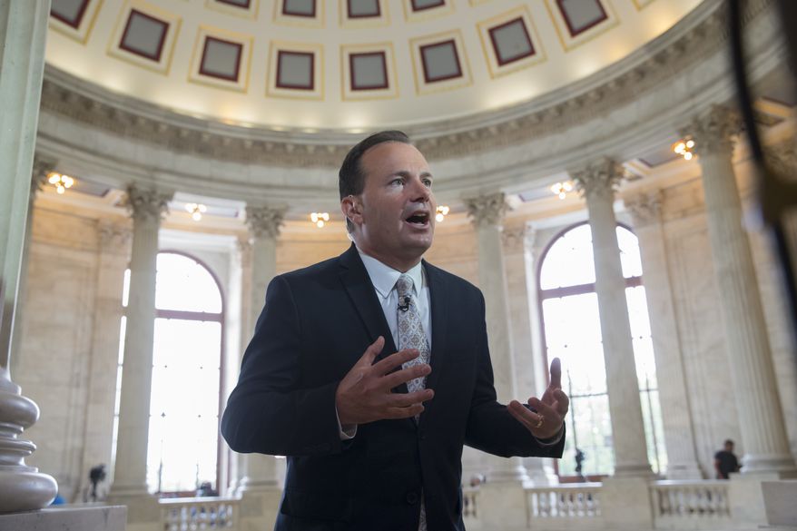 Sen. Mike Lee, R-Utah responds to questions about his opposition to the GOP health care bill, during a TV news interview on Capitol Hill in Washington, Tuesday, July 11, 2017. Lee and Sen. Ted Cruz, R-Texas, are pushing a revision to let insurers sell low-price policies with bare-bones coverage, as long as the company also sells a policy that covers a list of services like maternity care that Obama's law mandates. (AP Photo/J. Scott Applewhite)