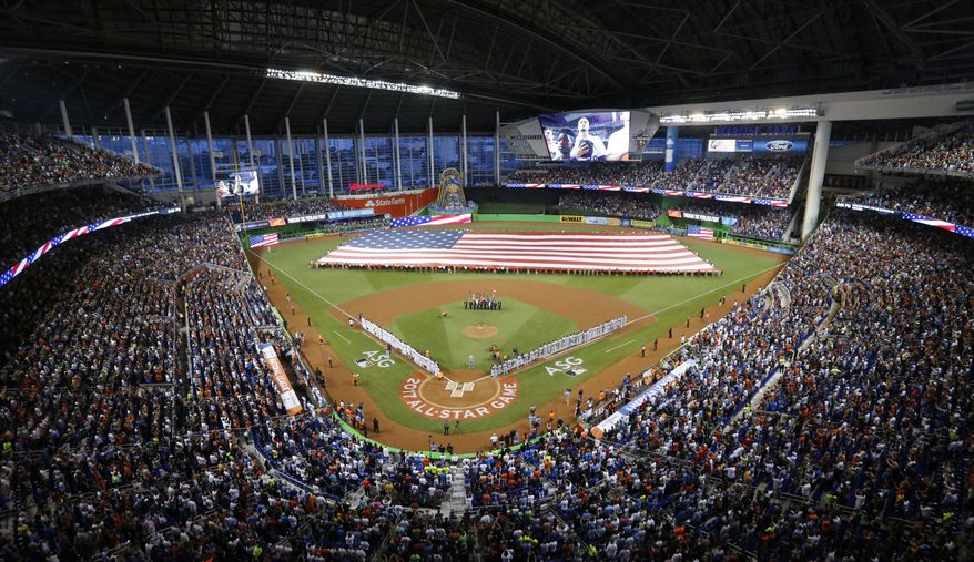 The National Anthem is played during the MLB baseball All-Star Game, Tuesday, July 11, 2017, in Miami. (AP Photo/Wilfredo Lee)