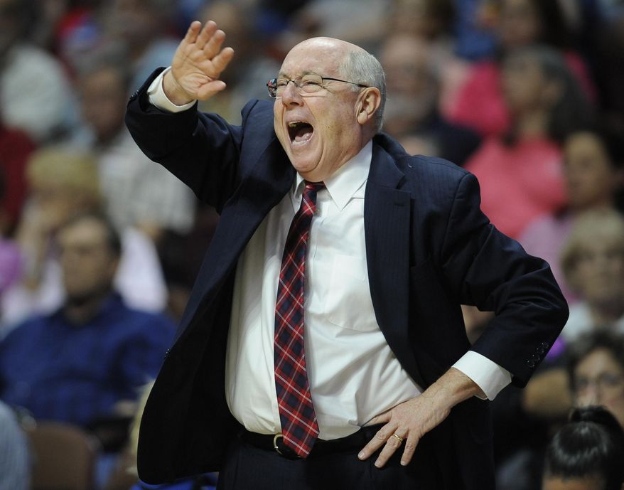 FILE - In this June 14, 2016, file photo, Washington Mystics head coach Mike Thibault calls out to officials during the first half of a WNBA basketball game against the Connecticut Sun, in Uncasville, Conn. The WNBA is in its second year of a new playoff format that takes the top eight teams regardless of conference and puts them in the postseason, diminishing the value of the Eastern and Western Conferences. That doesn’t mean that coaches aren’t still interested in coming in first in their respective conferences.  “Sure it means something still,” Washington coach Mike Thibault said.(AP Photo/Jessica Hill, File)