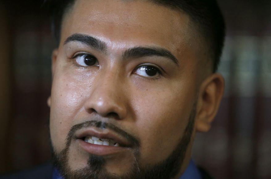 Luis Vicente Pedrote-Salinas listens to a question during a news conference Tuesday, July 11, 2017, in Chicago. Pedrote, 25, a Mexican immigrant ordered to leave the country voluntarily filed a lawsuit against Chicago police Tuesday, alleging he was wrongly listed in a gang database and that it cost him the chance to get protection through a federal program and remain in the U.S. (AP Photo/Charles Rex Arbogast)