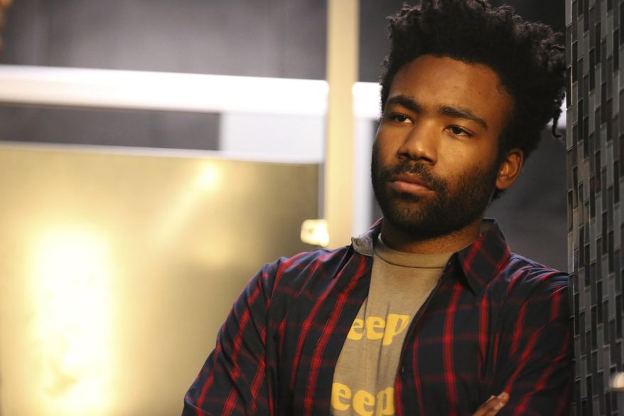 In this image released by FX, Donald Glover portrays Earnest Marks in the comedy "Atlanta." Glover, Aziz Ansari and Issa Rae are among those who star in shows they also created or co-created, write and sometimes even direct. In return, they could reap Emmy nominations in a number of categories. The nominations will be announced Thursday. The Emmy Awards ceremony is set to air Sept. 17 on CBS, hosted by Stephen Colbert. (Quantrell D. Colbert/FX via AP)