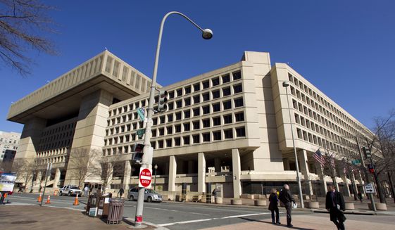  In this Feb. 3, 2012 file photo, the Federal Bureau of Investigation (FBI) headquarters in Washington. (AP Photo/Manuel Balce Ceneta, File) **FILE** 