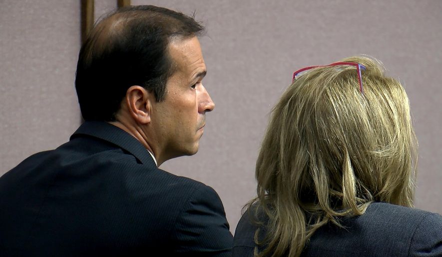 Former El Paso County Sheriff Terry Maketa, left, listens in the courtroom Tuesday, July 11, 2017, in Colorado Springs, Colo. A judge declared a partial mistrial Tuesday after Maketa accused of official misconduct was acquitted of three of seven counts. (Adam Knapik/KOAA-TV via AP, Pool)